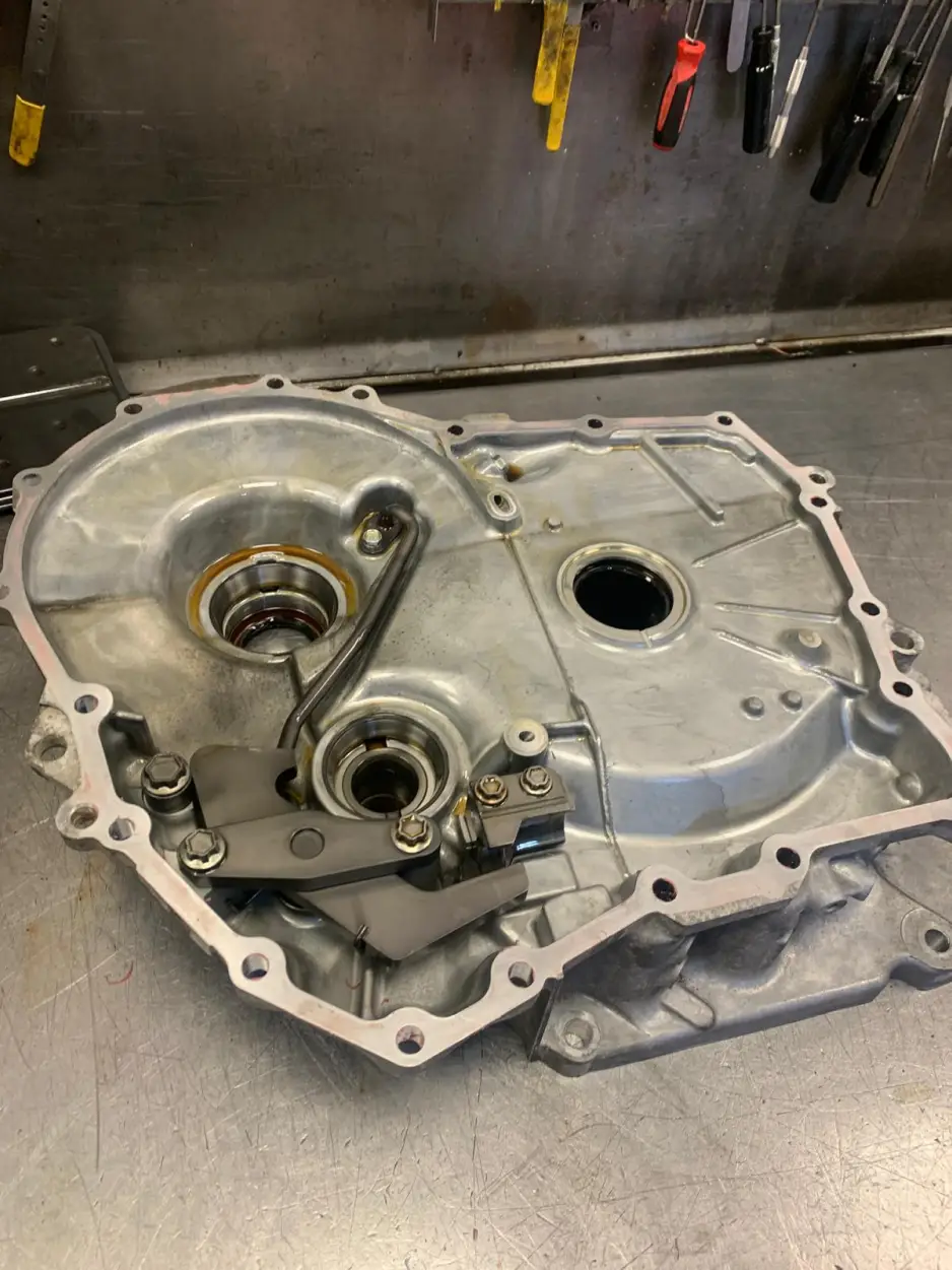 Nissan gearbox half casing on workbench after cleaning and inspection before reassembly